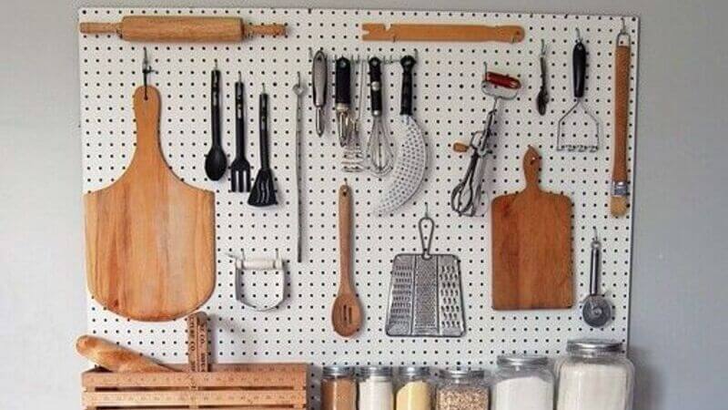Store kitchen utensils on a whiteboard a pegboard
