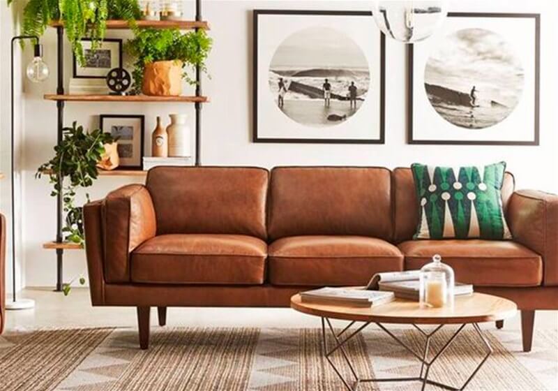 2. Sofa with cushions and decorative frames