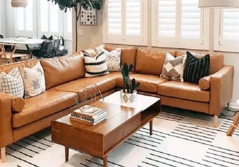 3. Brown leather sofa with textured items