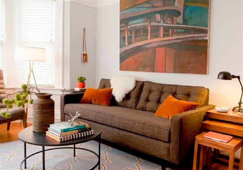 7. Brown sofa with colored pillows