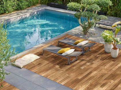 14- A wooden decking with a smooth and natural finish, ideal for poolside