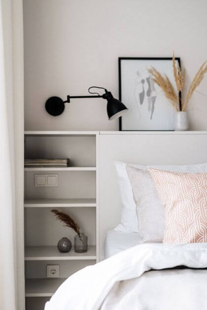 4- Well-designed small storage units for a headboard with its shelves
